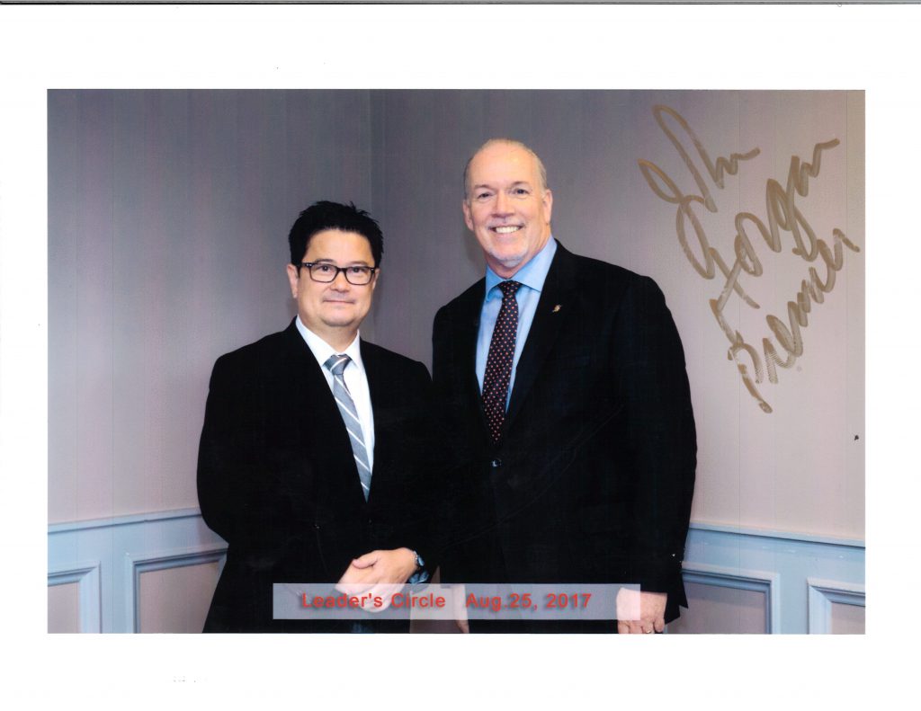 Anthony Remedios and John Horgan, the Premier of British Columbia