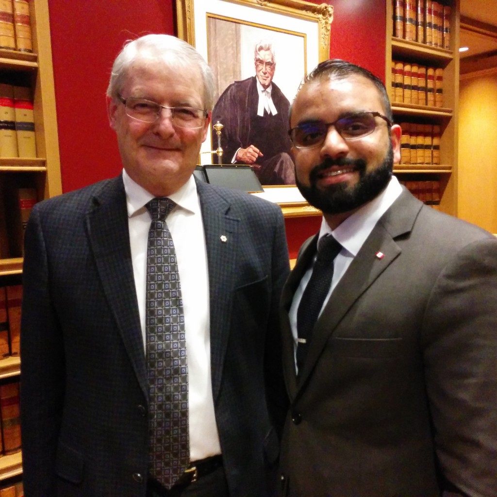 Sasha Ramnarine with the Federal Government Minister of Transport, Marc Garneau.
